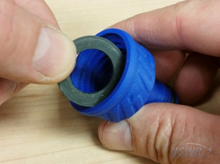 The 1 inch rubber flat washer is placed  inside the nozzle.