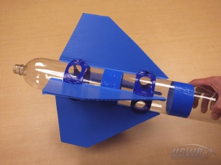 The Fin Bracket Assembly is mounted on a Water Rocket and the Nylon Screws are tightened.
