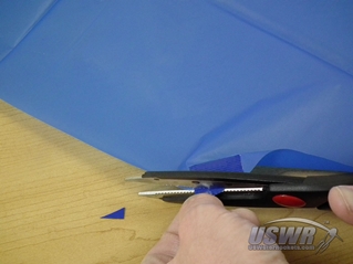 Cut the excess duct tape to make neater corners.