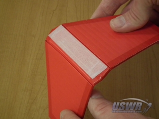 If you only score the one layer of the corriflute, it will fold along the hinge.