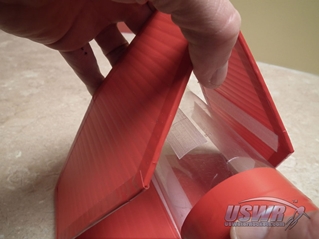 Slide the fins over the rocket and collapse them until the velcro attaches them securely.