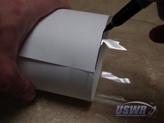 Use paper as a guide to draw cut line using marker.