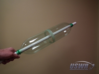 The rod inserted through the bottle necks will insure that the bottles are perfectly aligned and centered properly.