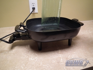 Remove the bottle from the water quickly.