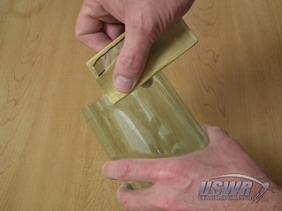 Use a sharp hobby knife to cut carefully along the cut line.