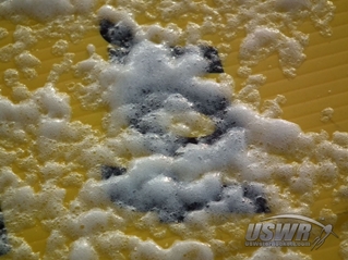 The paint stripper should begin to dissolve the printing very quickly.