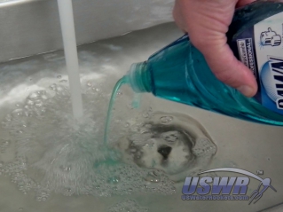 Make a solution of dishwashing detergent and water.