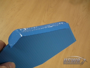 Center the tape along each fin edge.