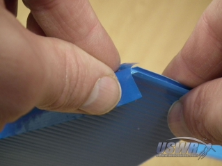 Fold the tape around the sides of the fins.
