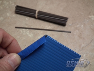 A small straw or dowel can be used to make a rounded fin edge.