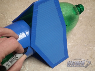 Mark the points where the fins touch the rocket so you have a reference point to align the velcro strips on the body.