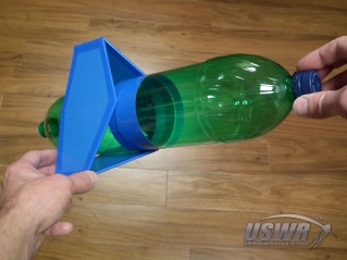 Slide the fin box over the rocket body while holding the velcro apart. When positioned correctly, let the velcro mate together and secure the fins in place.