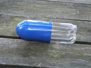 A Payload Compartment made from the base section of a bottle with a Nosecone installed.