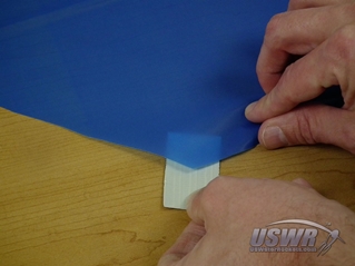 Reinforce the corners of the parachute with Duct tape.