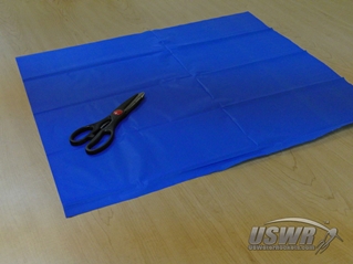 A square of plastic material is needed for the parachute.