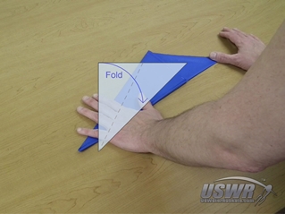 The fourth fold takes the left edge and folds it to meet the diagonal fold.