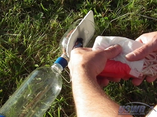 The folded Parachute is stowed in the area between the bottle necks.