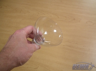 Cut the top and bottom off a bottle to form the Parachute Cover.