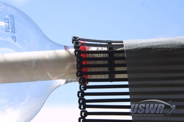 Wrap the cable ties and tape around the launch tube with the cable ties aligned with the raised grip on the bottle.