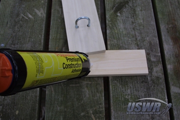 Use adhesive to secure the legs to the main spar.