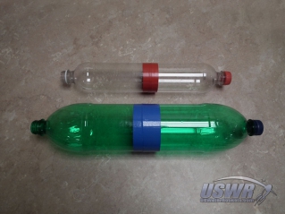 Spliced bottles forming the pressure vessels for water rockets need fins to fly in a stable manner.