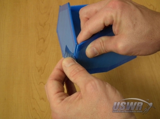 Fold the fins into a triangular box and tape the final edge. (Make sure the velcro is facing inwards.)