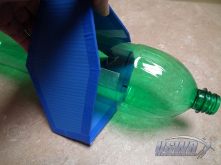 Hold the fins apart so the velcro does not touch while you slide the rocket into the fin box.