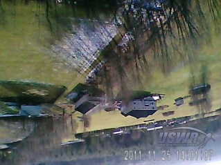 A light snow is visible on the ground from this image taken from about 150 feet in altitude on the way down by one of the sideways viewing cameras.