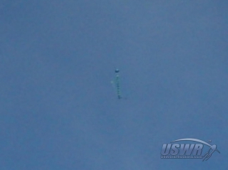 The tangled parachute is visible in this image of the rocket coming down after apogee.