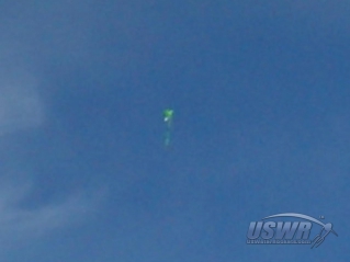 The parachute begins to catch the air and turn the rocket over to the upright position.