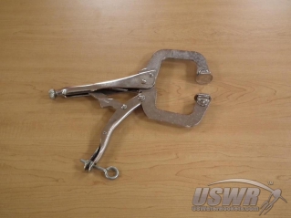 This welding clamp has smooth faces which could slide off the collar if not adapted.